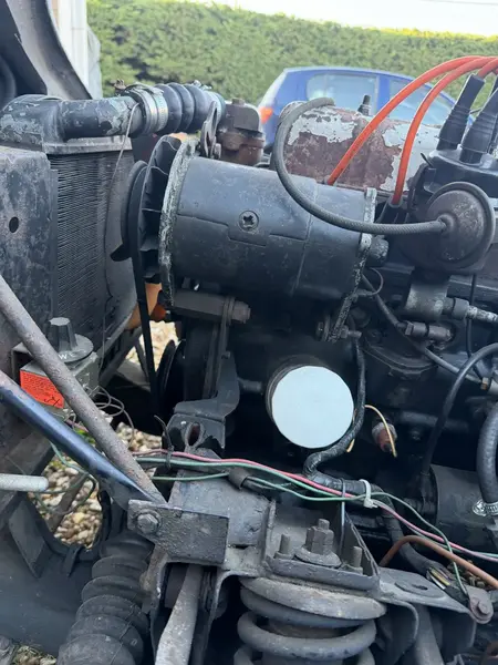 The original Lucas C40 dynamo on the left-hand side of the engine. 